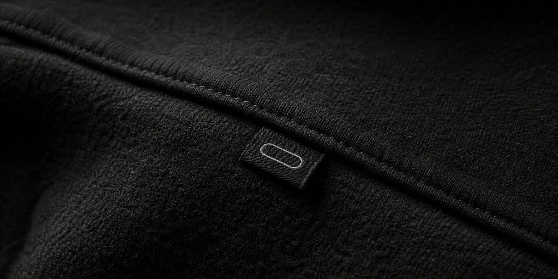 Close-up detail of INLOOP premium streetwear fabric