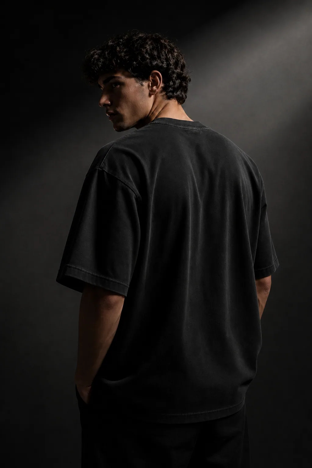 Oversized black INLOOP t-shirt showing heavyweight fabric structure