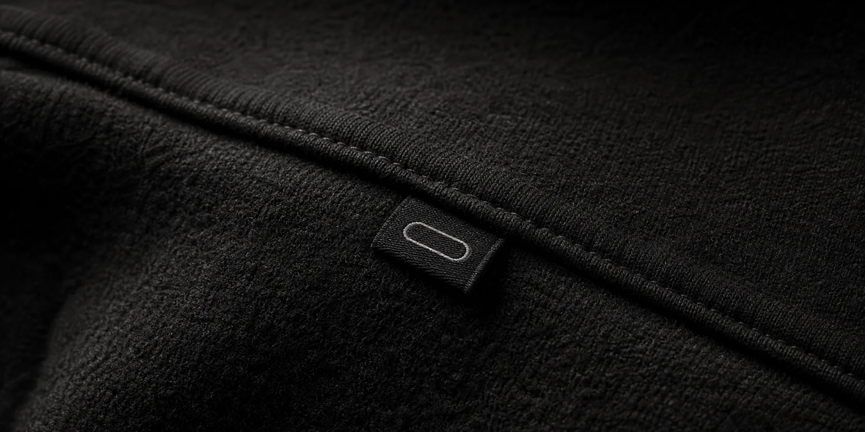 Close-up of heavyweight INLOOP fabric and garment label