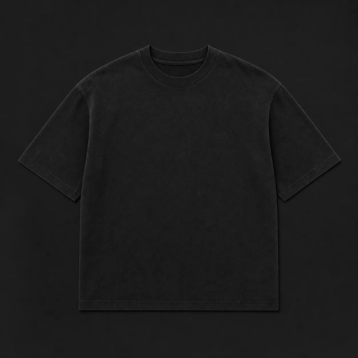 Black oversized t-shirt laid flat for size measurements